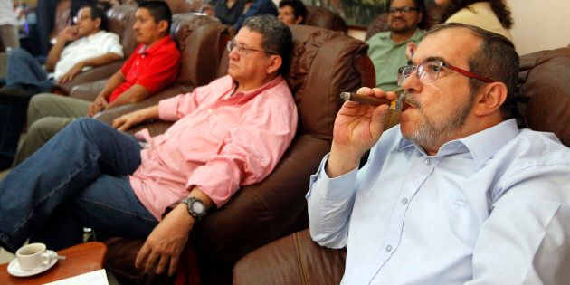 HAVANA, CUBA - OCTOBER 02: Rodrigo Londoño Echeverri, also known as Timochenko and Timoleón Jimenez, the top leader of the Revolutionary Armed Forces of Colombia, FARC, smokes a cuban cigar while waits for the final count of votes of the plebiscite held in Colombia on October 02, 2016 in Havana, Cuba. (Photo by Ernesto Mastrascusa/LatinContent/Getty Images)