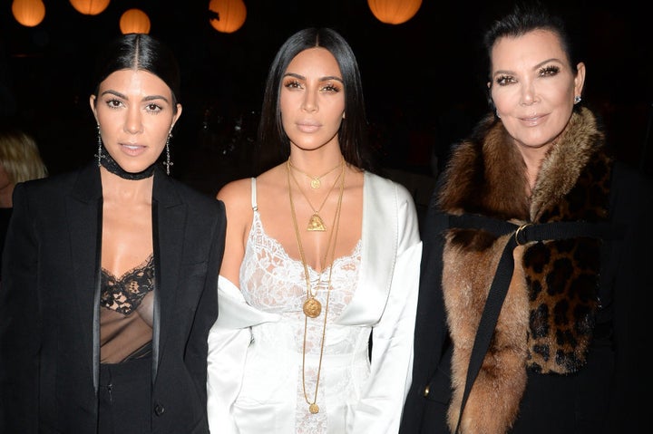 Kourtney Kardashian, Kim Kardashian and Kris Jenner attend the Givenchy show in Paris earlier in the day before the robbery took place.