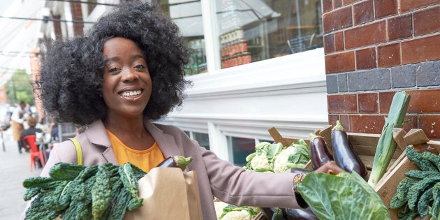 Young woman shopping for fresh produce.