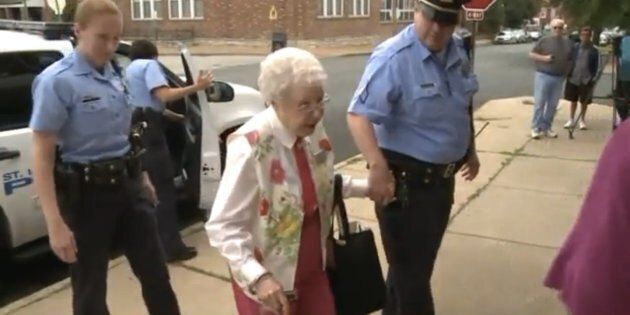 Edie Simms exits a St Louis Police Department cruiser on Friday