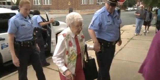 Edie Simms exits a St Louis Police Department cruiser on Friday