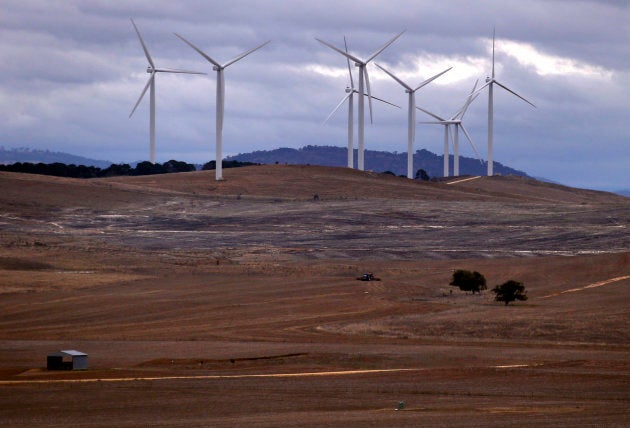 A farmer ploughs a field in front of wind turbines. You never saw a similar sentence that ends with the word "coal mine".