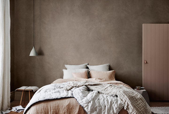 Styled by Bree Leech and Heather Nette King for Dulux Colour Trends 2017, this room features Dulux Suede Effect Macchiato Malt and door in Pragmatic. Curtain and bedlinen, from Throw Hale Mercantile & Co, Leather cushion on bed from Designstuff, and side table from Cult.