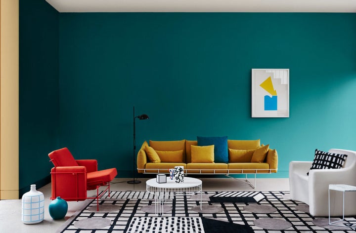 Styled by Bree Leech and Heather Nette King for Dulux Colour Trends 2017, this living room features Dulux Deep Arctic and the wall return in Hay Wain. the red chair if from Cult, rug and sofa from Living Edge and floor lamp from Ajar.