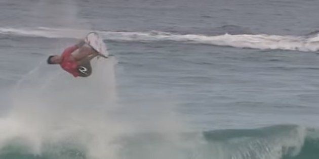 Gabriel Medina backflips on a wave and yes, he lands it.