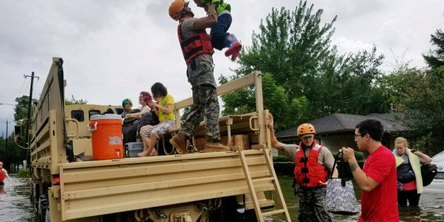 Texas National Guard soldiers aid residents in heavily flooded areas in Houston.