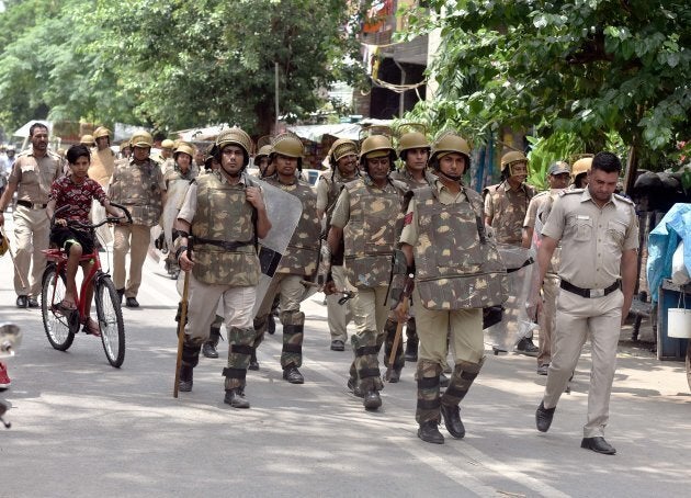 Delhi Police personnel patrolling amid tightened security.