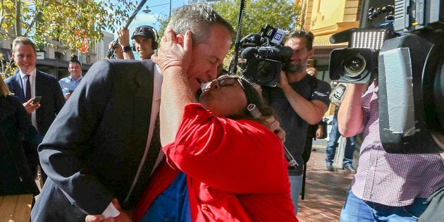 Bill Shorten receives one of two kisses from Margot