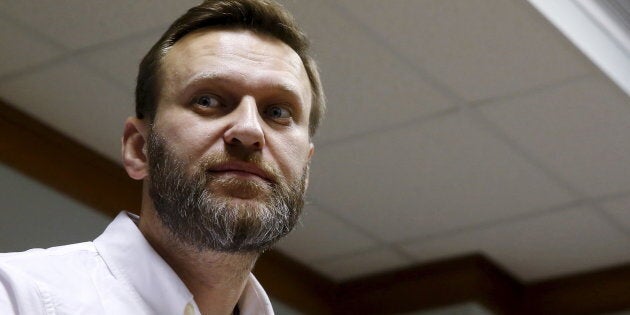 Russian anti-corruption campaigner Alexei Navalny and fellow activists were attacked at an airport by assailants described as Cossacks.