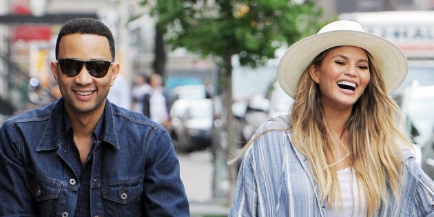 NEW YORK, NY - MAY 14: John Legend and Chrissy Teigen with new born Luna out for a long walk home after lunch at Il Buco in East Village on May 14, 2016 in New York, NY. (Photo by Josiah Kamau/BuzzFoto via Getty Images)