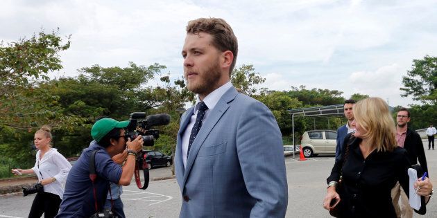 Jack Walker, one of the nine Australian men detained for stripping down to their underwear at the Malaysian Grand Prix, has quit his political position.