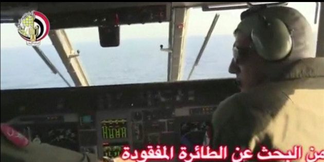 Pilots of an Egyptian military plane take part in a search operation for the EgyptAir plane that disappeared in the Mediterranean Sea in this still image taken from video May 19, 2016. Egyptian Military/Handout via Reuters TV ATTENTION EDITORS - THIS IMAGE WAS PROVIDED BY A THIRD PARTY. EDITORIAL USE ONLY. NO RESALES. NO ARCHIVE.