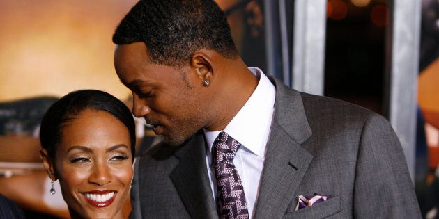 Actors Will Smith (R) and Jada Pinkett Smith arrive to attend the premiere of the film