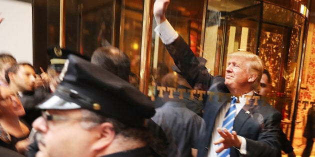 Donald Trump greets supporters outside of Trump Towers in Manhattan October 8, 2016 in New York City.