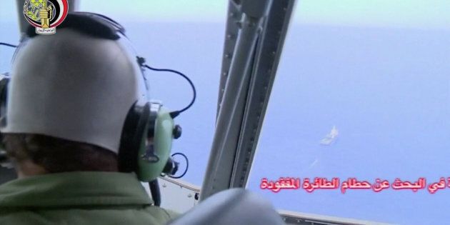 A pilot looks out of the cockpit during a search operation by Egyptian air and navy forces for the crashed EgyptAir plane in the Mediterranean Sea.