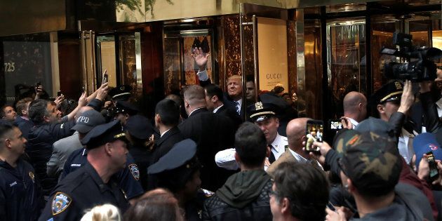 Donald Trump waves to supporters outside Trump Tower on Saturday.