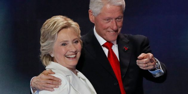 Democratic presidential nominee Hillary Clinton stands with her husband, former president Bill Clinton, after accepting the nomination on the final night of the Democratic National Convention in Philadelphia, Pennsylvania, U.S. July 28, 2016. REUTERS/Mike Segar