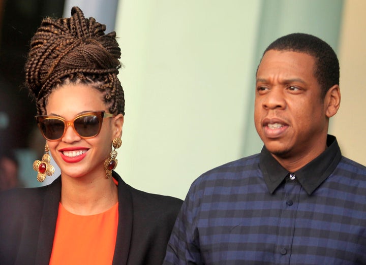 U.S. singer Beyonce (L) and her husband rapper Jay-Z walk as they leave their hotel in Havana April 4, 2013. REUTERS/Enrique De La Osa (CUBA - Tags: ENTERTAINMENT)