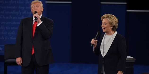US Democratic presidential candidate Hillary Clinton and US Republican presidential candidate Donald Trump debate during the second presidential debate at Washington University in St. Louis, Missouri, on October 9, 2016. / AFP / Robyn Beck (Photo credit should read ROBYN BECK/AFP/Getty Images)