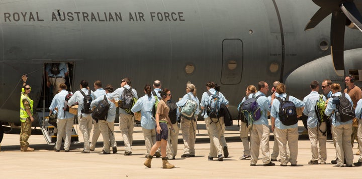 Australian teams board a plane at the RAAF Base enroute to to the Philippines.