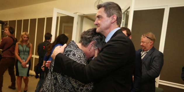Rodney Croome comforts Shelley Argent after Opposition Leader Bill Shorten's press conference at Parliament House