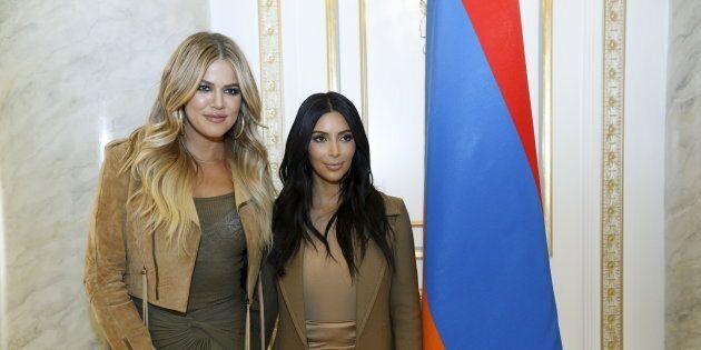 US reality TV star Kim Kardashian (L) and her sister Khloe visit the genocide memorial, which commemorates the 1915 mass killing of Armenians in the Ottoman Empire, in Yerevan on April 10, 2015. AFP PHOTO / KAREN MINASYAN (Photo credit should read KAREN MINASYAN/AFP/Getty Images)