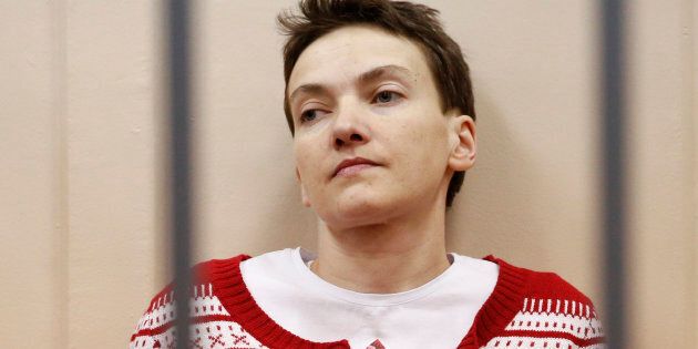Ukrainian military pilot Nadezhda Savchenko looks out from a defendants' cage as she attends a court hearing in Moscow March 4, 2015.