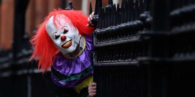POSED BY MODEL A person wearing a clown costume in a street in Liverpool. The "killer clown" craze has continued to spread across the UK with one force dealing with 14 reports in 24 hours.
