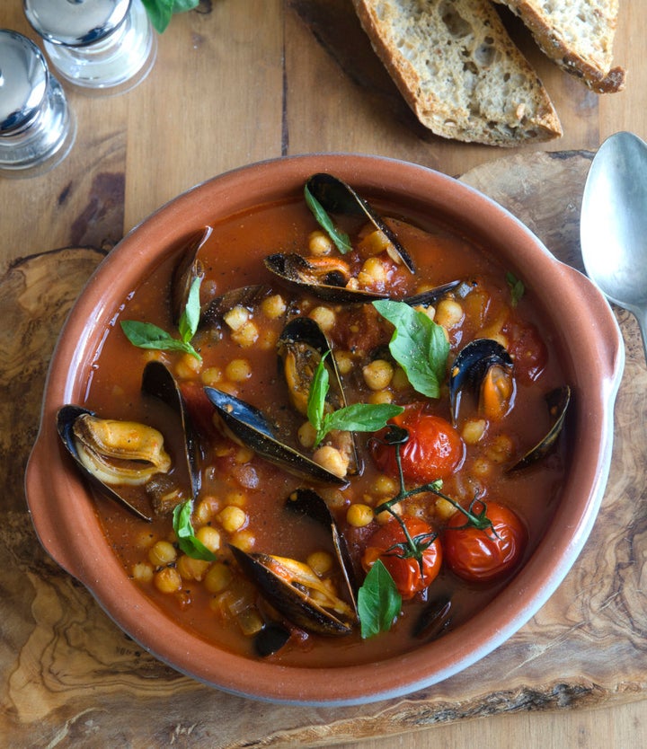 Spicy harissa mussels with tomato, chickpeas and basil.