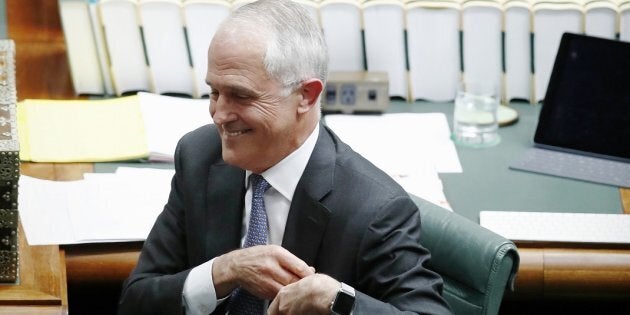 Prime Minister Malcolm Turnbull stands to answer a question from Opposition Leader Bill Shorten after the High Court's decision on the marriage equality postal survey, during Question Time at Parliament House on Thursday