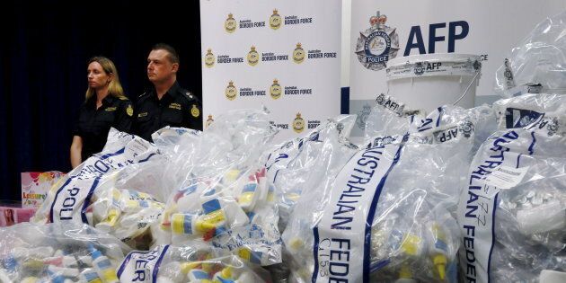 A quantity of liquid methamphetamine disguised in various packaging is put on display by Australian Border Force officers at the Australian Federal Police headquarters in Sydney, February 15, 2016.