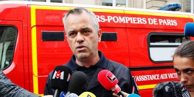 Fire chief Eric Moulin speaks to journalists near the scene in Paris
