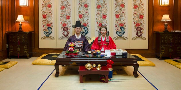 A couple poses in a traditional wedding hall in Anyang, South Korea.