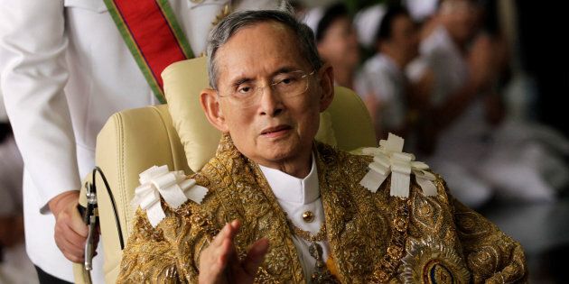 Thailand's King Bhumibol Adulyadej waves as he returns to Siriraj Hospital after a ceremony at the Grand Palace in Bangkok in this December 5, 2010 file photo. REUTERS/Damir Sagolj/File Photo TPX IMAGES OF THE DAY