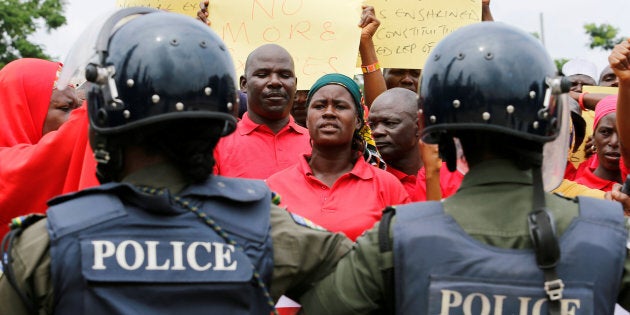 A parent of one of the abducted Chibok school girls cries after the police prevented the parents access to see President Muhammadu Buhari during a rally in Abuja, Nigeria August 25, 2016. REUTERS/Afolabi Sotunde