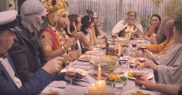 The religious deities gathered around the table in the MLA ad