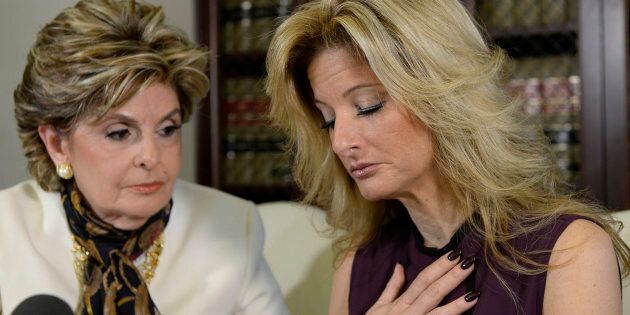 Summer Zervos, a former contestant on the TV show The Apprentice, reacts next to lawyer Gloria Allred (L) while speaking about allegations of sexual misconduct against Donald Trump during a news conference in Los Angeles, California, U.S. October 14, 2016. REUTERS/Kevork Djansezian