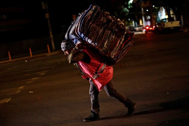 A volunteer carries blankets after an earthquake hit Mexico City, Mexico, September 8, 2017.