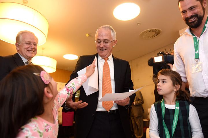 Prime Minister Malcolm Turnbull makes a new friend on day 23 of the campaign trail.