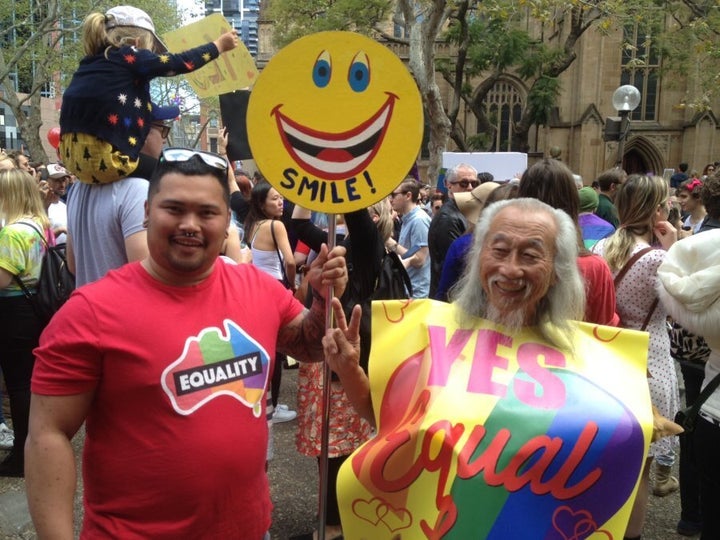 Gay marriage supporter Warren (left) with Sydney peace activist Danny Lim.