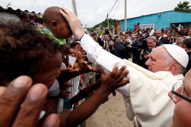 Pope Francis greets people in a neighbourhood in Cartagena, Colombia.