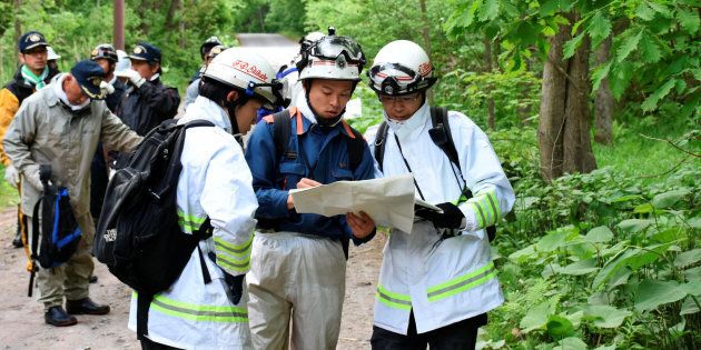 People search for a seven-year-old boy who went missing two days earlier, in Nanae town on the northernmost Japanese main island of Hokkaido, Japan, in this photo taken by May 30, 2016. Mandatory credit Kyodo/via REUTERS ATTENTION EDITORS - THIS IMAGE WAS PROVIDED BY A THIRD PARTY. EDITORIAL USE ONLY. MANDATORY CREDIT. JAPAN OUT. NO COMMERCIAL OR EDITORIAL SALES IN JAPAN. TPX IMAGES OF THE DAY