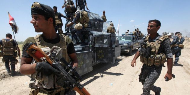 Iraqi security forces gather near Falluja, Iraq, May 31, 2016. REUTERS/Alaa Al-Marjani
