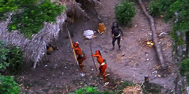 Members of an uncontacted tribe in Brazil's Amazon Basin were photographed by air in 2008. At least 10 members of a tribe in this region were reportedly killed by gold miners last month.