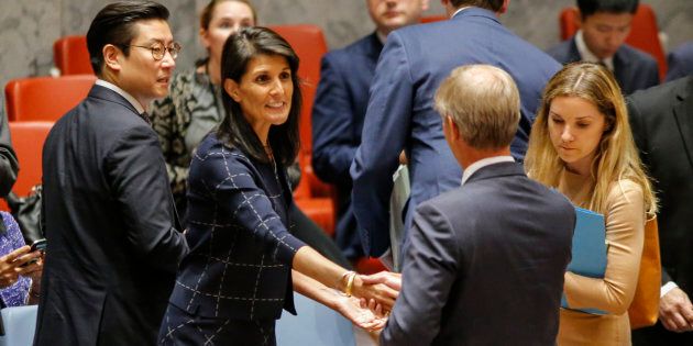 United States Ambassador to the United Nations Nikki Haley speaks with Sweden's ambassador Olof Skoog at a UN Security Council meeting in New York.