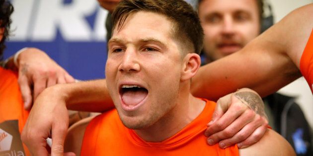 Toby Greene of the Giants sings the team song during the 2017 AFL round 21 match between the Western Bulldogs and the GWS Giants at Etihad Stadium on August 11, 2017 in Melbourne, Australia.