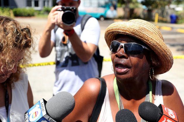 Flora Mitchell, of Dania Beach, answers questions from the media outside of the nursing home.