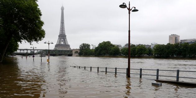 View of the flooded Seine near the Eiffel Tower in Paris on June 3, 2016, after days of almost nonstop rain. 