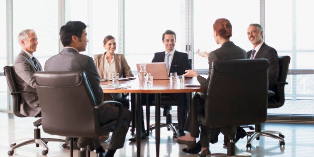 Business people meeting at table in conference room