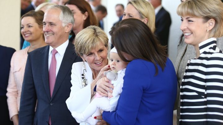 Julie Bishop and Kelly O'Dwyer have an moment with O'Dwyer's daughter, Olivia, as Turnbull's cabinet is sworn in.